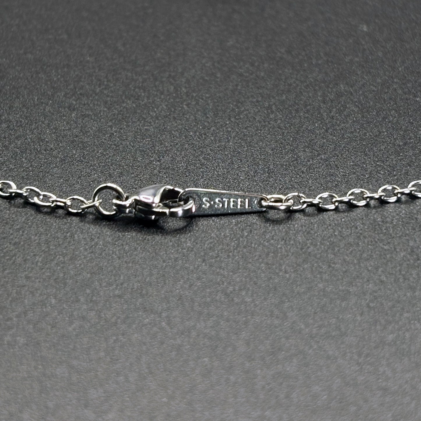 Close up of stainless necklace clasp, quality findings