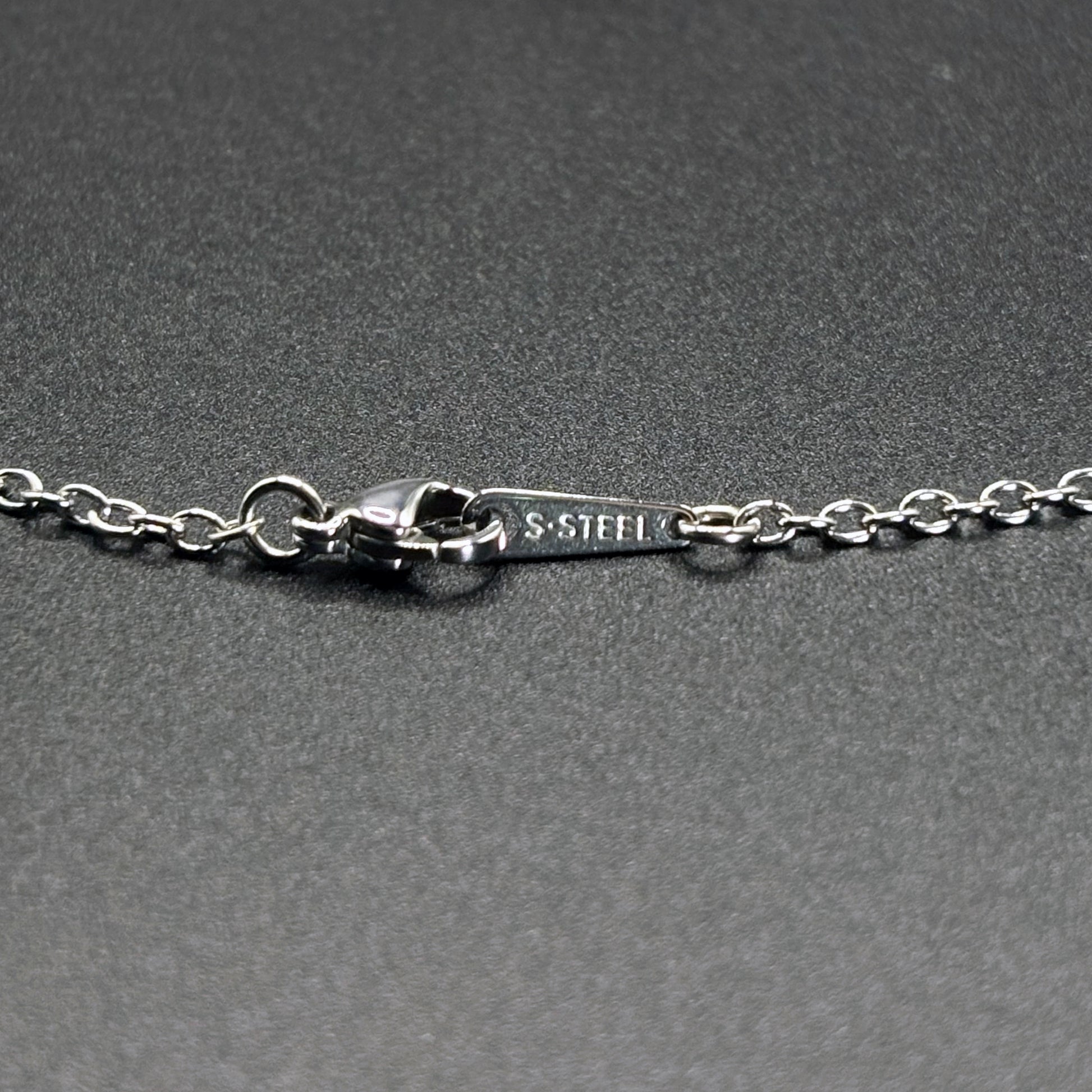 Close up of stainless necklace clasp, quality findings